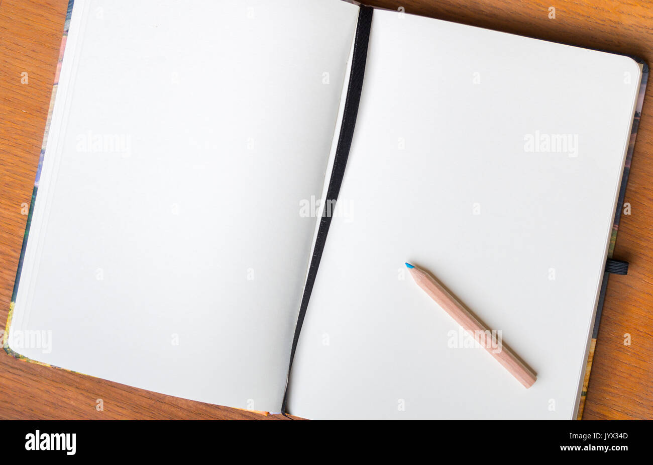 open book white pages with pencil Stock Photo Alamy