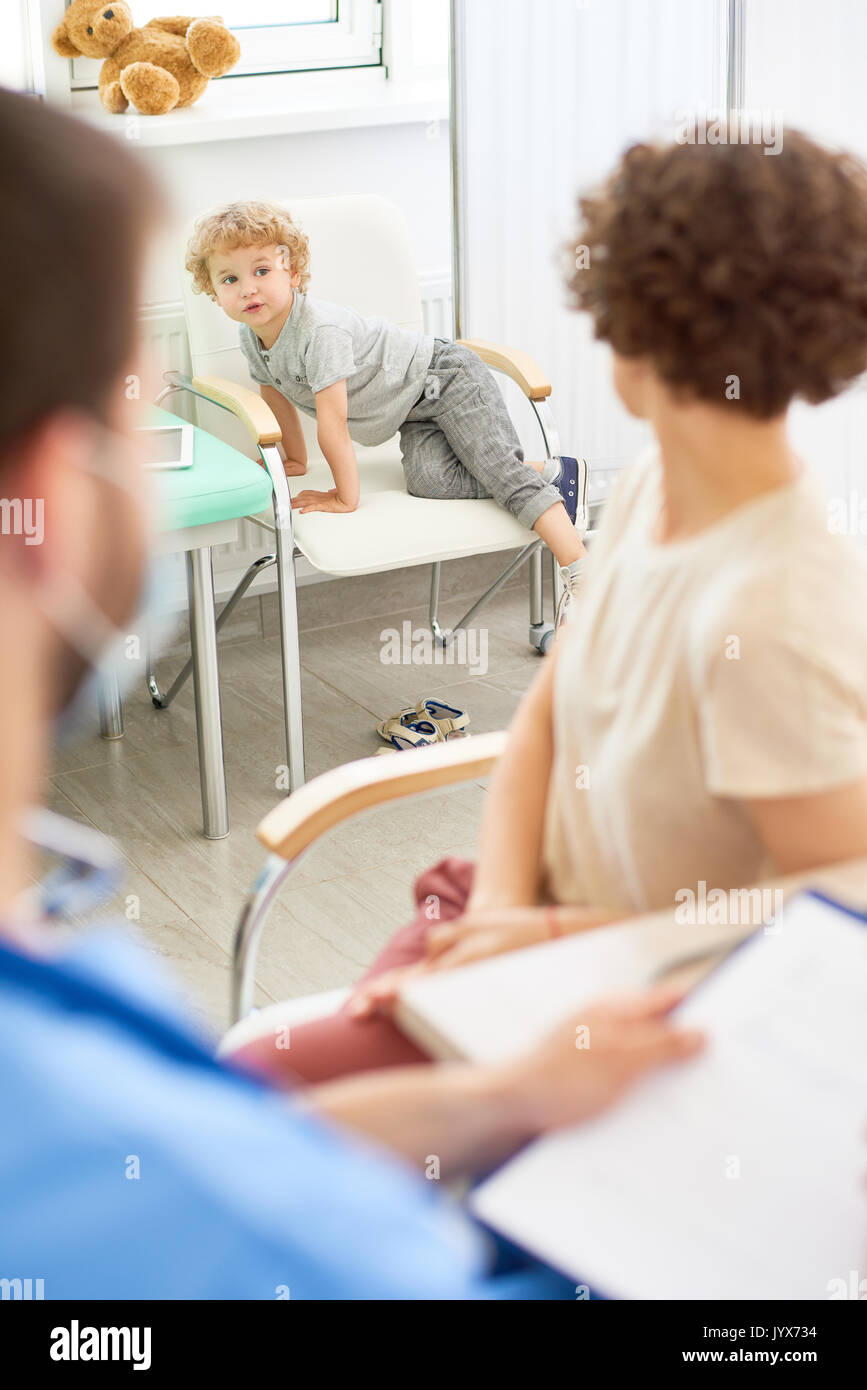 Restless Child in Doctors Office Stock Photo