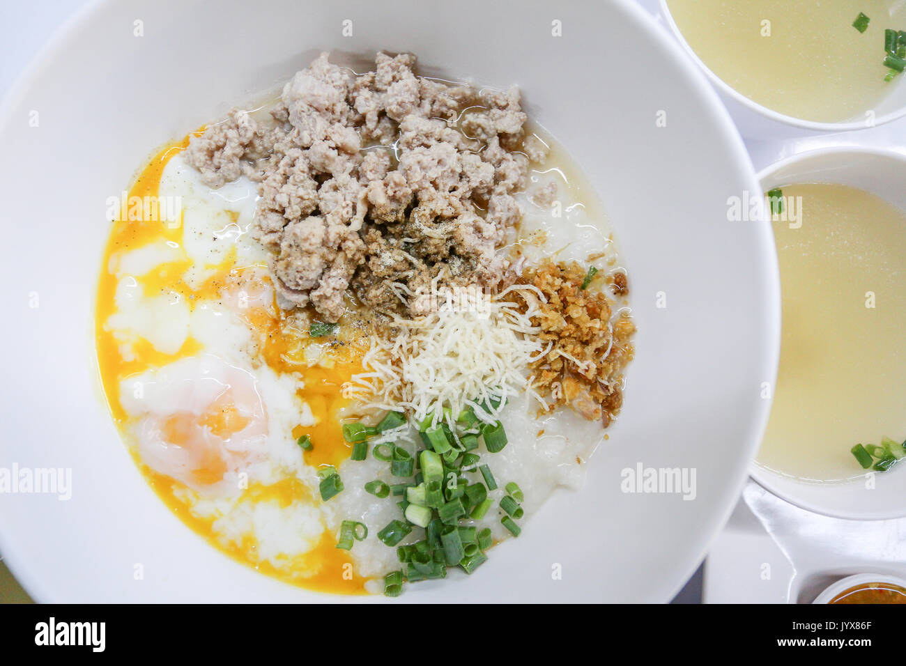 rice porridge with mince pork and soft boiled egg Stock Photo
