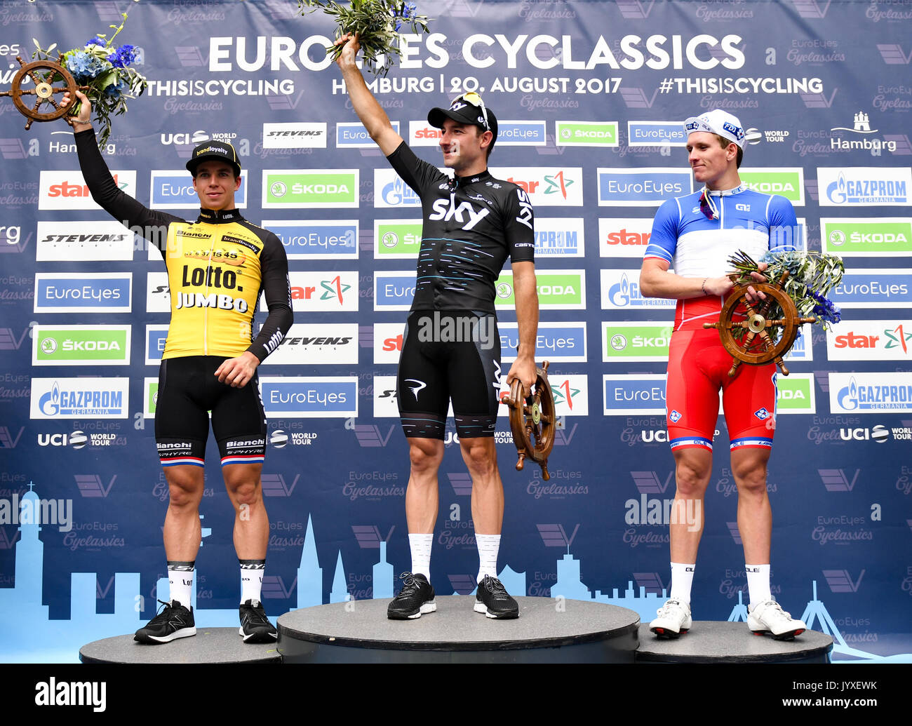 Hamburg, Germany. 20th Aug, 2017. Elia Viviani (C) of Italy celebrates his victory in the Euro Eyes Cyclassics in Hamburg, Germany, 20 August 2017. Arnaud Demare of France (R) came second and Dylan Groenewegen of the Netherlands (L) came third. Photo: Axel Heimken/dpa/Alamy Live News Stock Photo