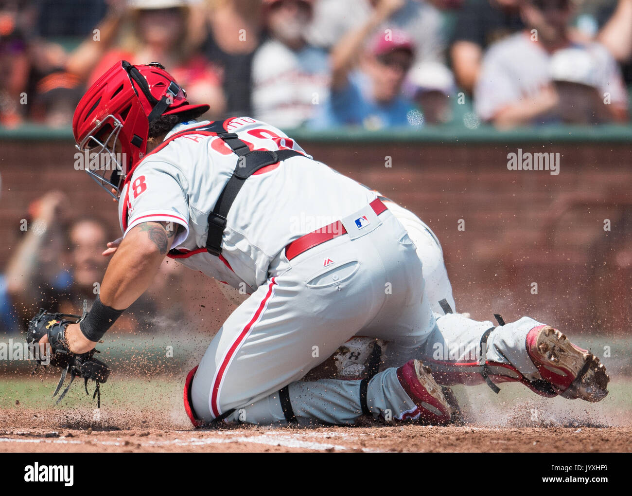 San Francisco, USA. 20th Aug, 2017. Philadelphia Phillies catcher Jorge Alfaro (38) makes the tag on SF catcher Buster Posey (not shown) during a MLB game between the Philadelphia Phillies and the San Francisco Giants at AT&T Park in San Francisco, California. Credit: Cal Sport Media/Alamy Live News Stock Photo
