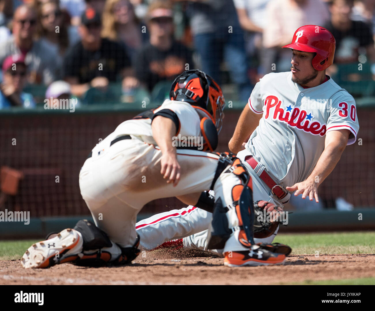San Francisco, USA. 20th Aug, 2017. Philadelphia Phillies left fielder Cameron Perkins (30) is tagged out by Giants catcher Buster Posey (28), during the seventh inning of a MLB game between the Philadelphia Phillies and the San Francisco Giants at AT&T Park in San Francisco, California. Credit: Cal Sport Media/Alamy Live News Stock Photo