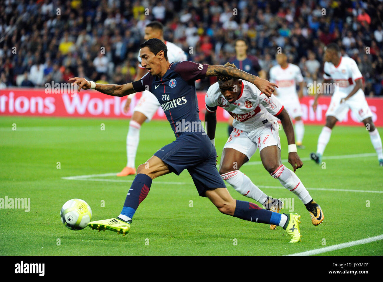Paris. 20th Aug, 2017. Angel Di Maria (L) from Paris Saint Germain competes with Francois Moubandje (R) from Toulouse FC during their match of French Ligue 1 2017-2018 season 3rd round in Paris, France on Aug. 20, 2017. Paris Saint Germain won Toulouse FC with 6-2 at home. Credit: Jean-Marie Hervio/Xinhua/Alamy Live News Stock Photo