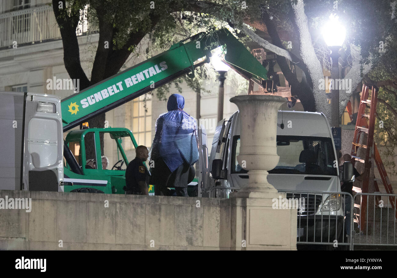 Workers remove the second of four statues of Confederate heroes at the University of Texas in a surprise midnight action before fall classes began in late August. The four are Stephen Hogg, Robert E. Lee, Sidney Johnston and John H. Reagan. Stock Photo