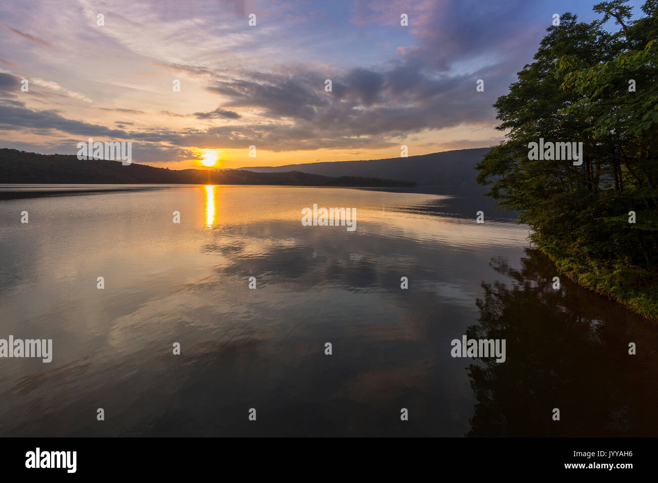 Sunrise On Beautiful Calm Mountain Lake Stock Photo