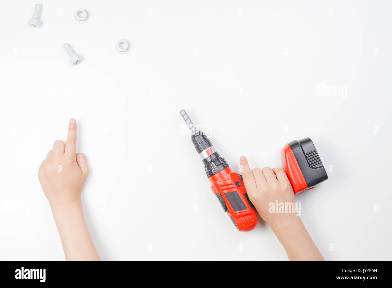Child's hands on white background. Boy pointing finger up and holding