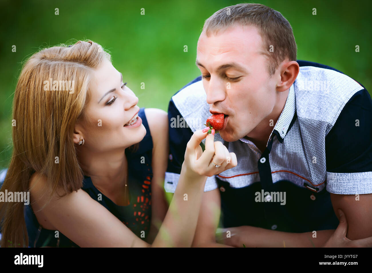 girl feeding boy