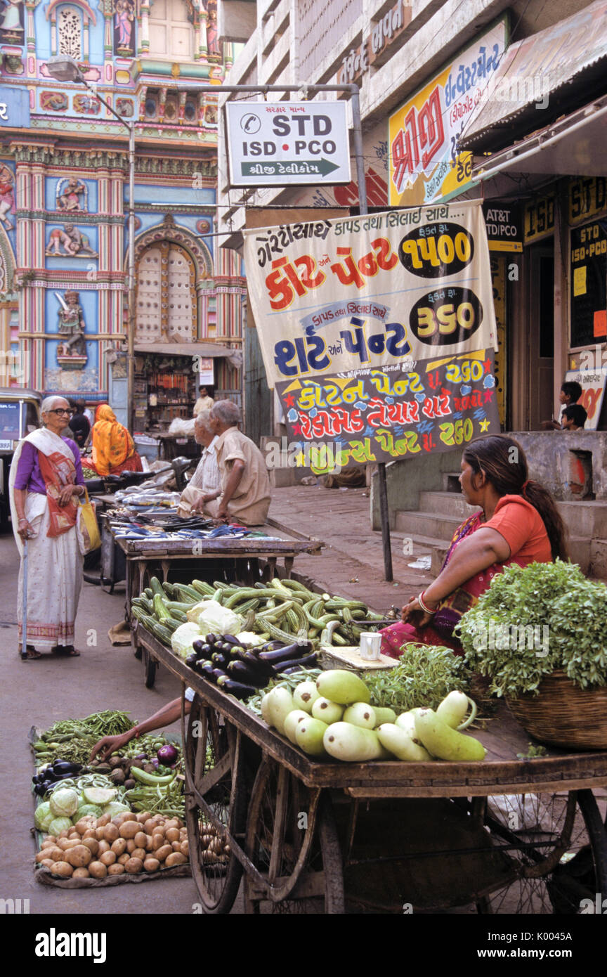 Street vendors outside ornate Hindu temple, Ahmedabad, Gujarat, India