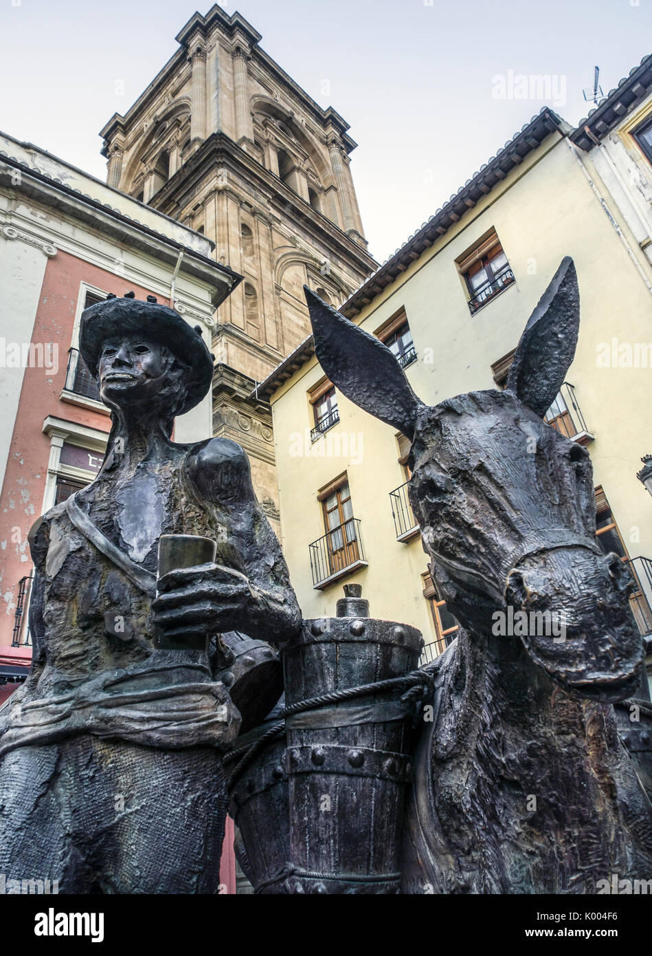 GRANADA, SPAIN Statue of a man and Donkey in Plaza de Romanilla in