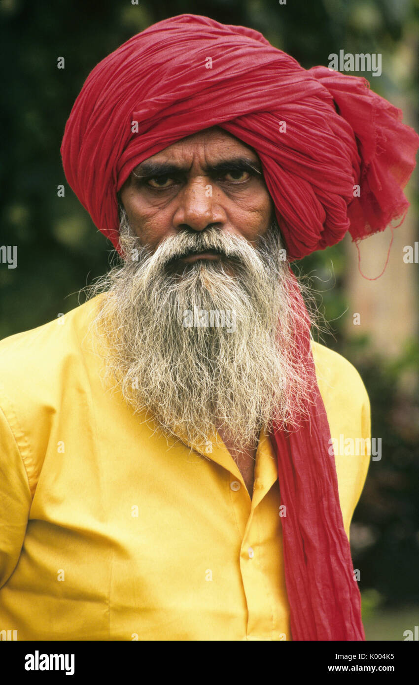 Elderly man in red turban, Varanasi (Benares, Banaras), India Stock Photo