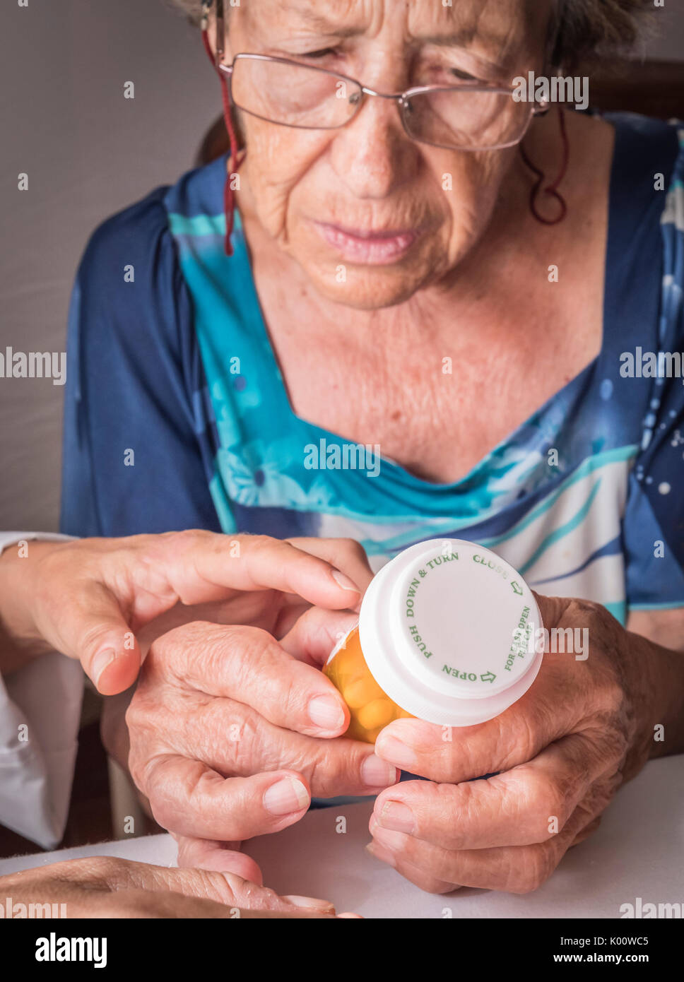 Doctor explains to elderly daily dose of medication, Andalusia, Spain Stock Photo