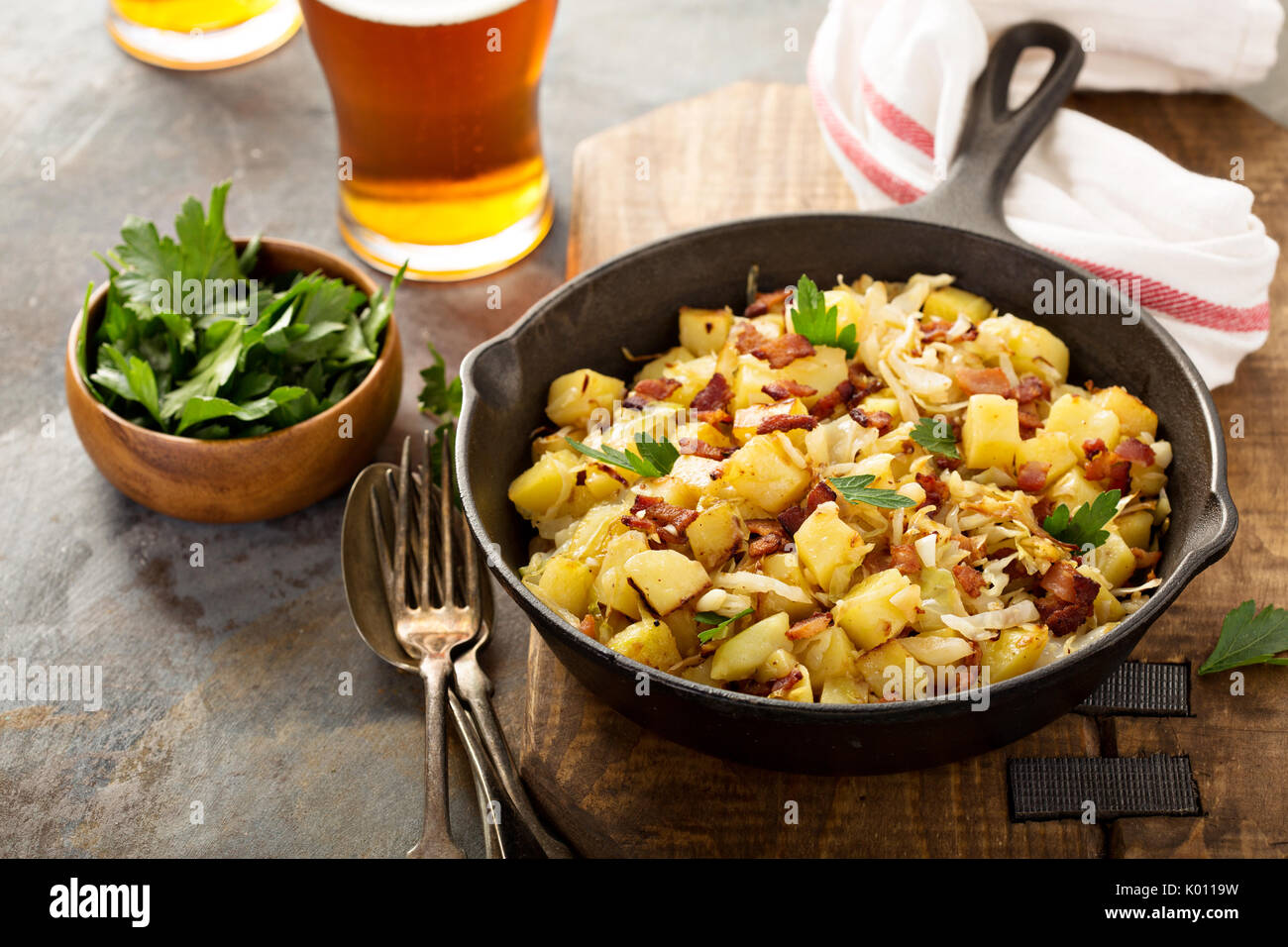 Fall side dish with fried cabbage, potatoes and bacon Stock Photo