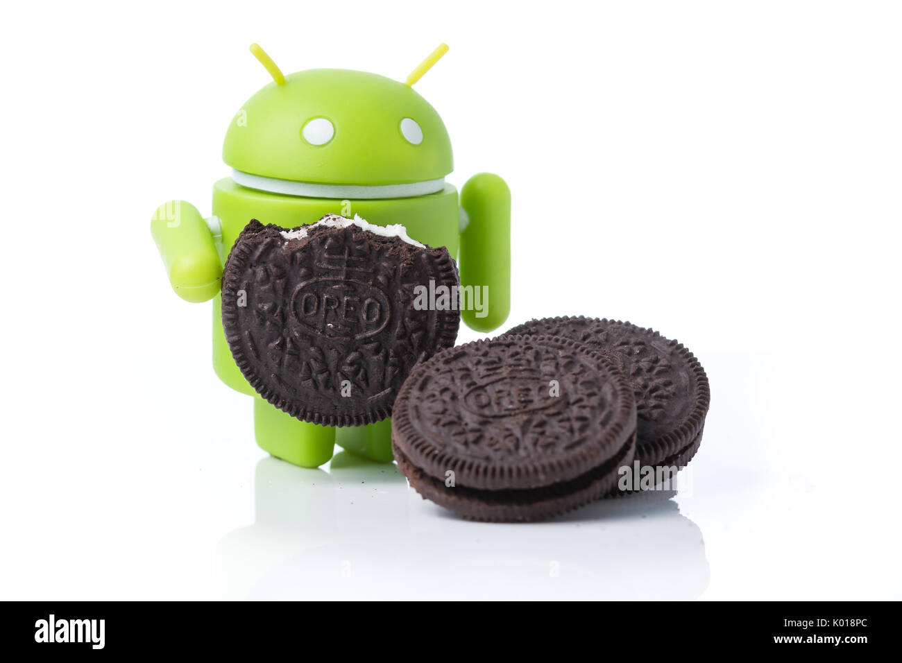 An android mascot surrounded by Oreo cookies Stock Photo