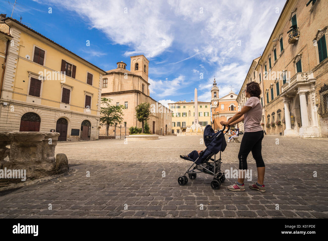 A view of the historical buildings and obelisk of the ancient Piazza Federico II Jesi Province of Ancona Marche Italy Europ Stock Photo