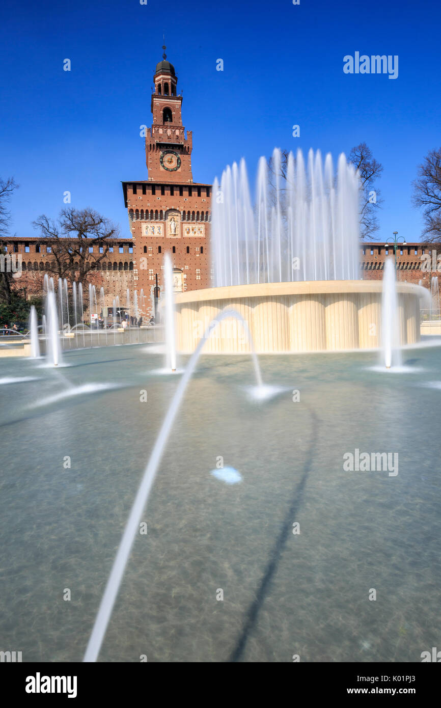 The fountain frames the ancient Sforza Castle Milan Lombardy Italy Europe Stock Photo