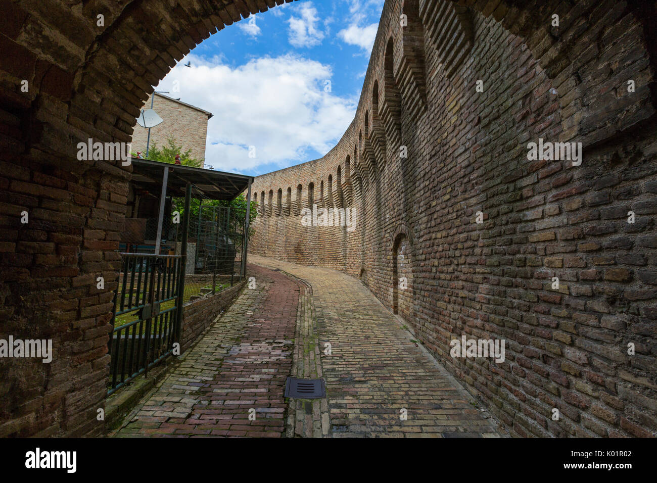 A typical alley and medieval walls of the old town of Corinaldo Province of Ancona Marche Italy Europe Stock Photo