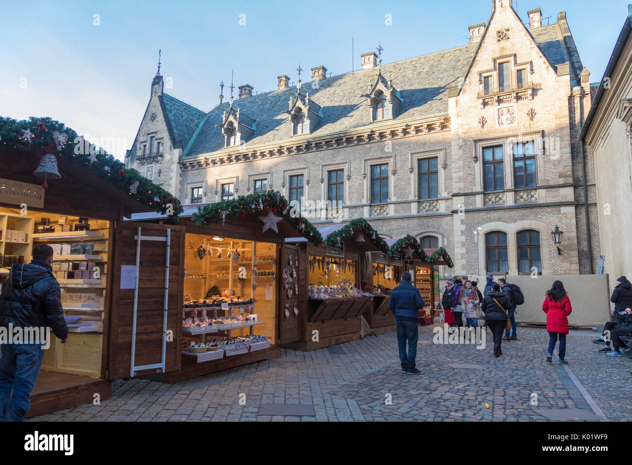 Tourists at the Christmas markets facing the Cathedral of Saint Vitus