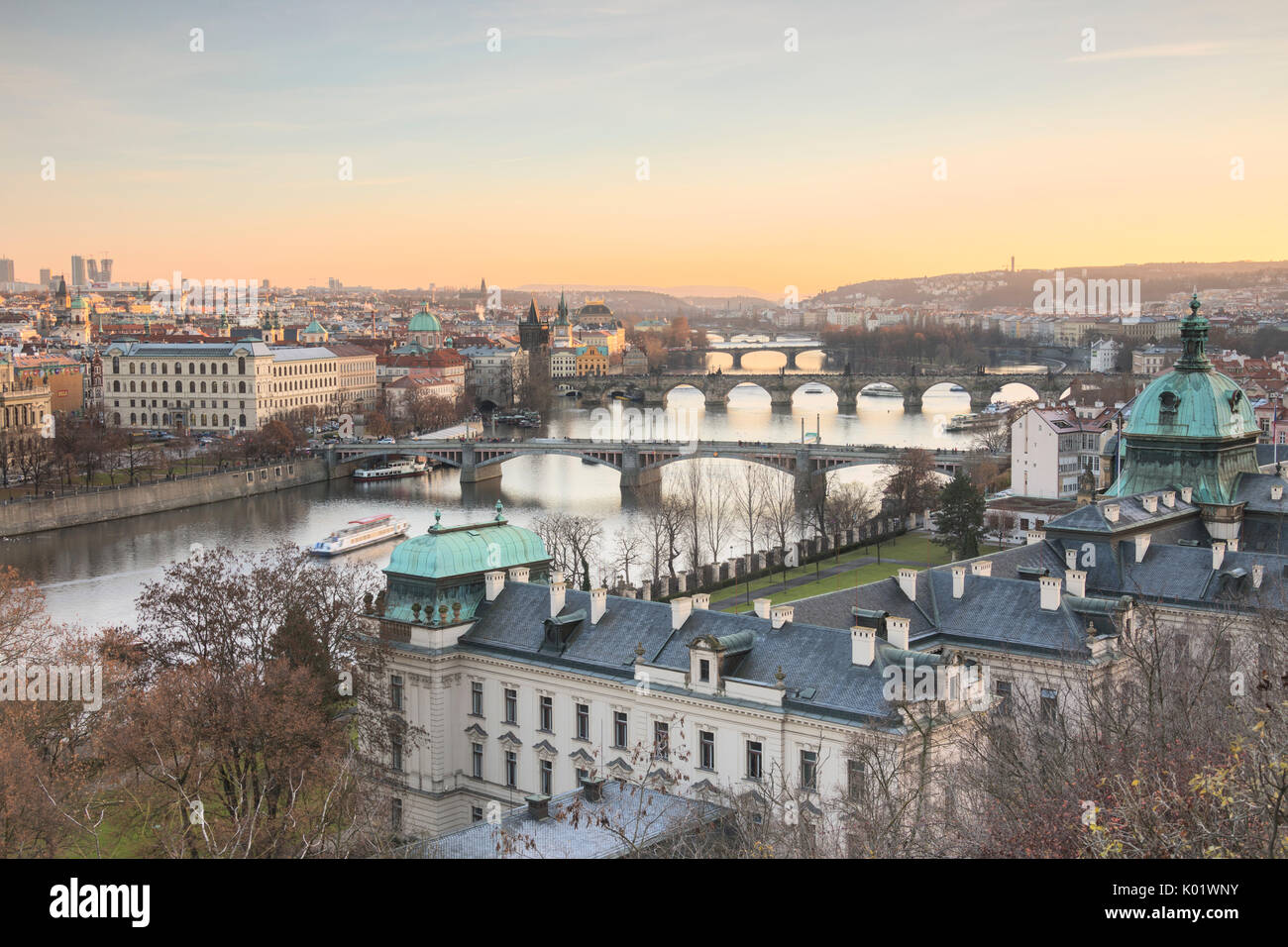 Sunset on the historical bridges and buildings reflected on Vltava (Moldava) river Prague Czech Republic Europe Stock Photo