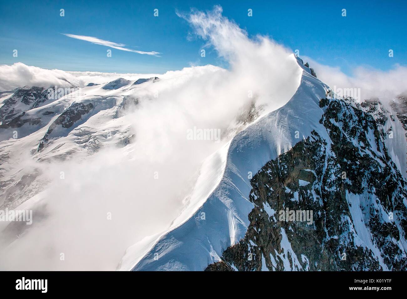 The sinuous shape of the Biancograt at the Piz Bernina,Bernina Engadin, Canton Graubuenden, Switzerland Stock Photo