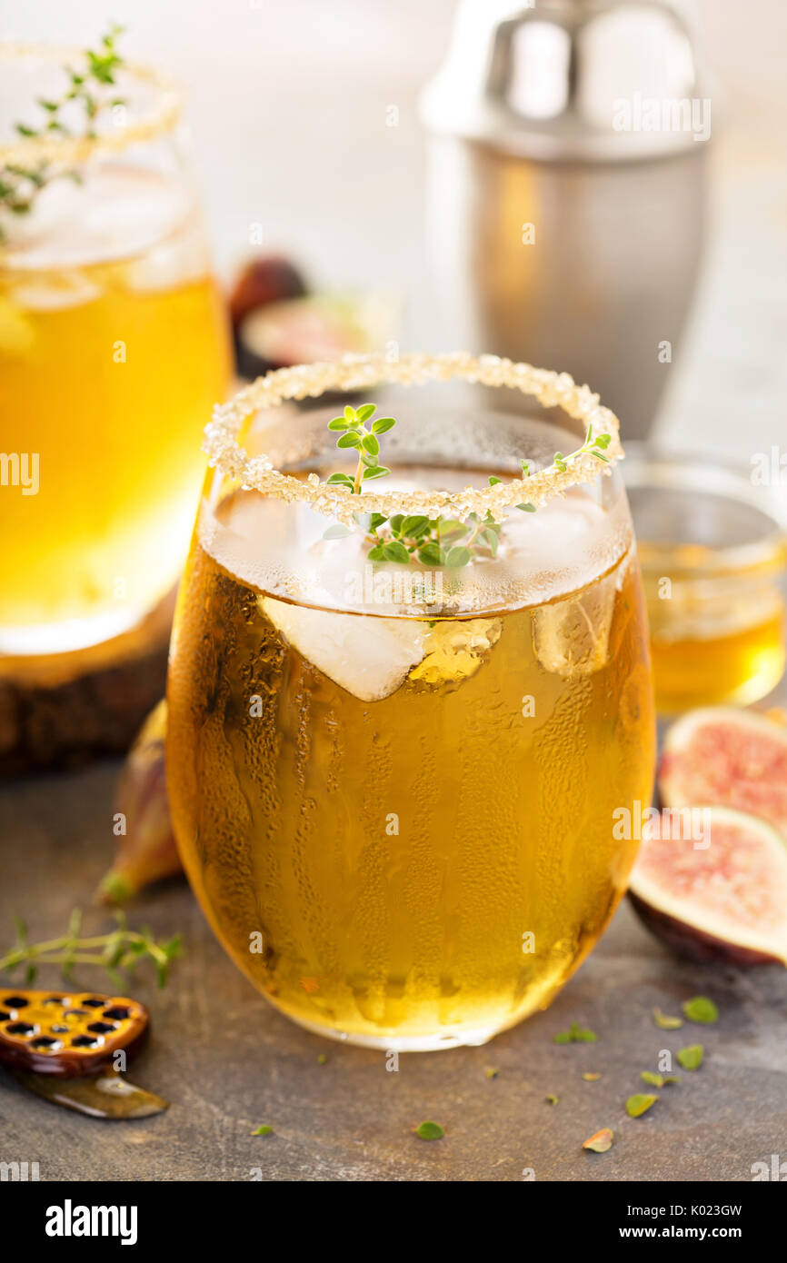 Fall refreshing cocktail with fig, honey and thyme Stock Photo Alamy