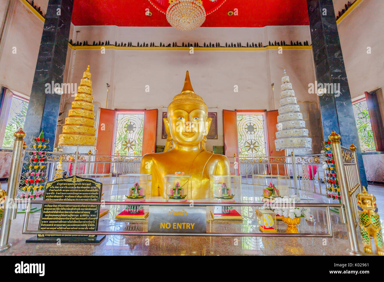 Wat Phra Thong is a famous temple in Phuket. Formerly when the war happened The people in Phuket brought the soil to cover the Buddha's gold to flood  Stock Photo