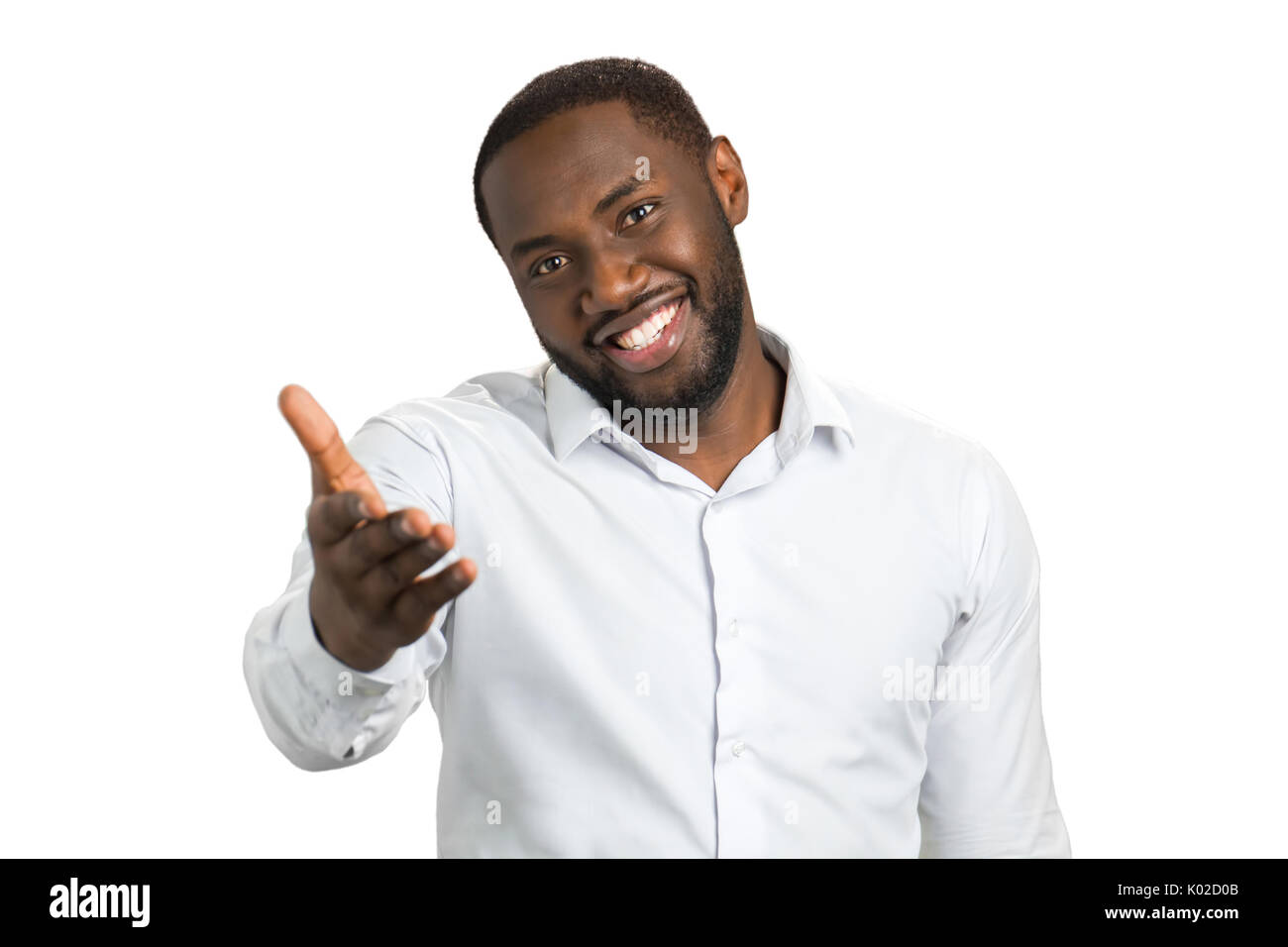 Dark Skinned Man With A Hand Outstretched Smiling Bearded Man Pointing At Somebody With Outstretched Hand Stock Photo Alamy