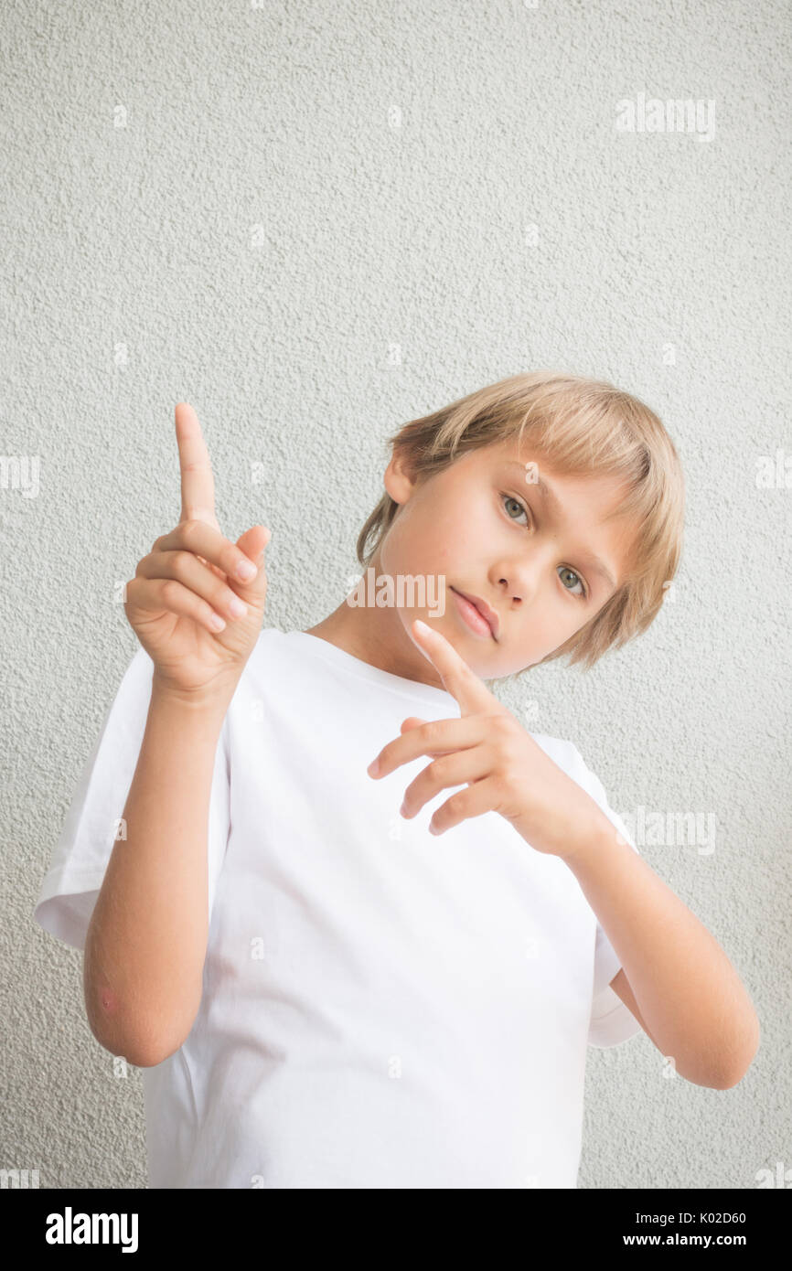 Boy pointing up with both hands Stock Photo - Alamy