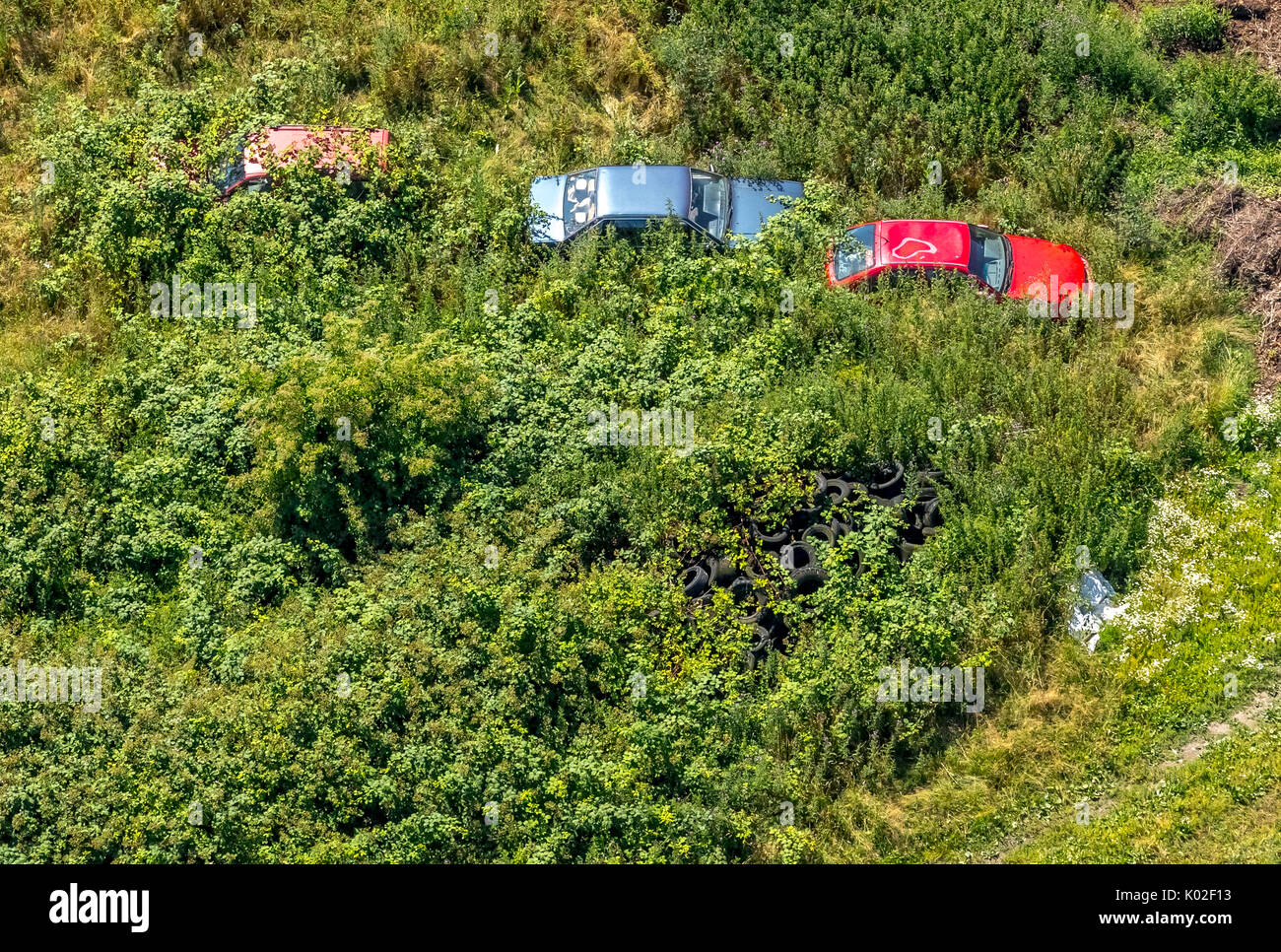wild Old car pile in Esborn, overgrown junk cars are in nature, Wetter (Ruhr), Ruhr area, North Rhine-Westphalia, Germany, Europe, Aerial View, Aerial Stock Photo
