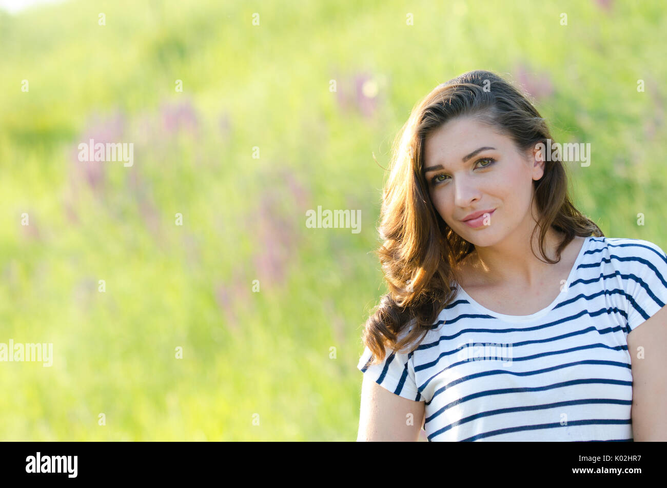 Portrait of a beautiful young girl on nature Stock Photo - Alamy