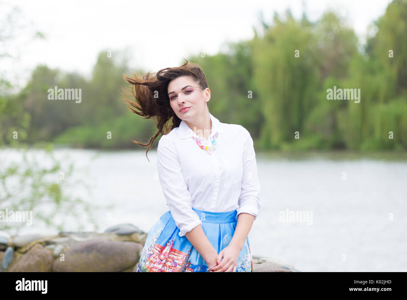 Portrait of a beautiful young girl on nature Stock Photo - Alamy