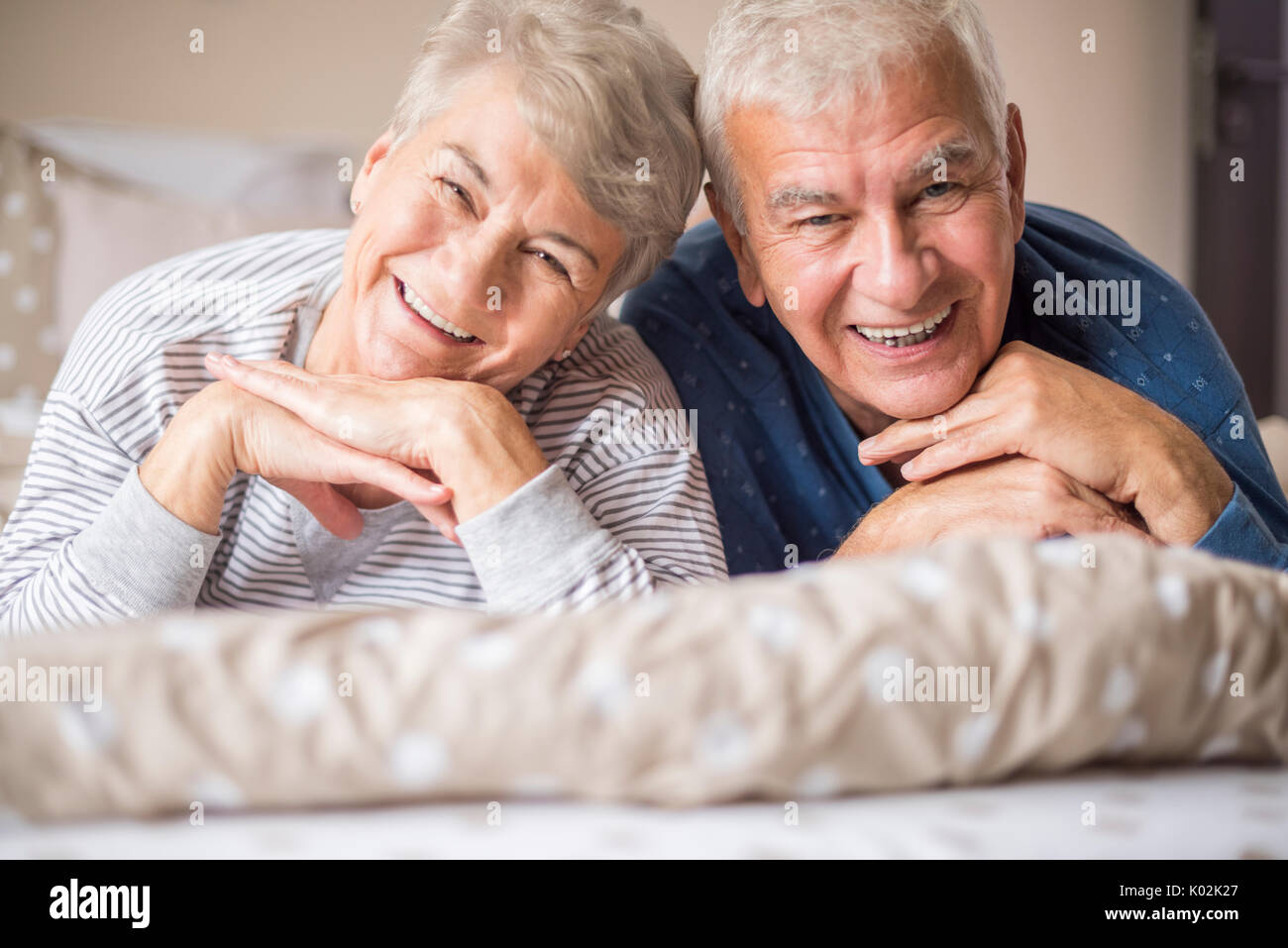 Portrait of cheerful senior adults in the bedroom Stock Photo