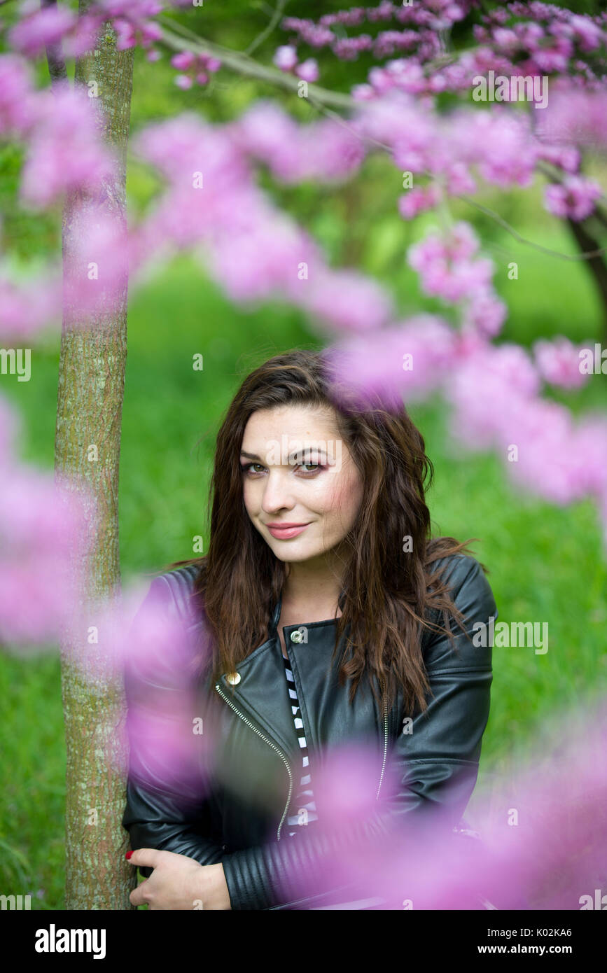 Portrait of a beautiful young girl on nature Stock Photo - Alamy