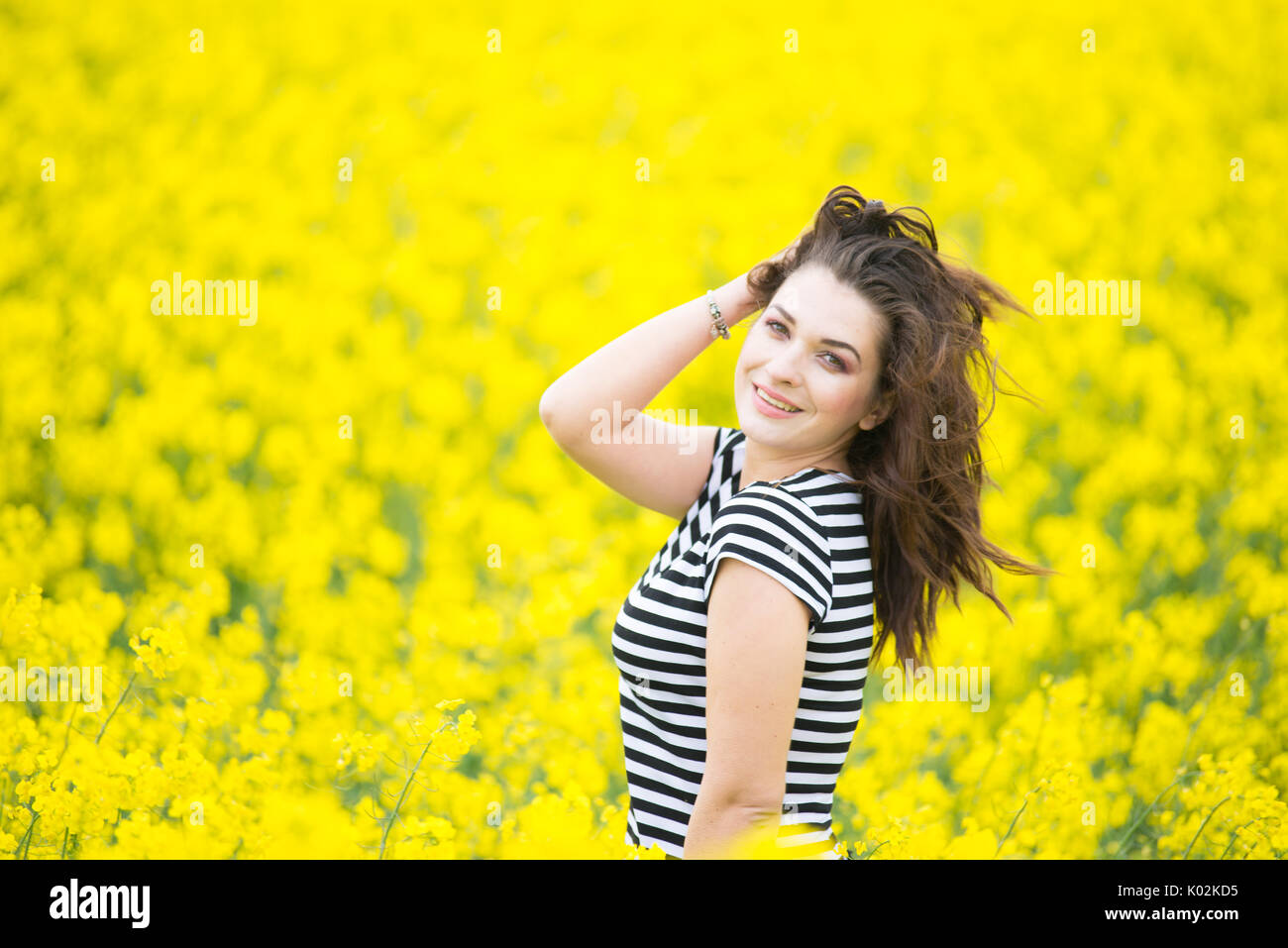 Portrait of a beautiful young girl on nature Stock Photo - Alamy