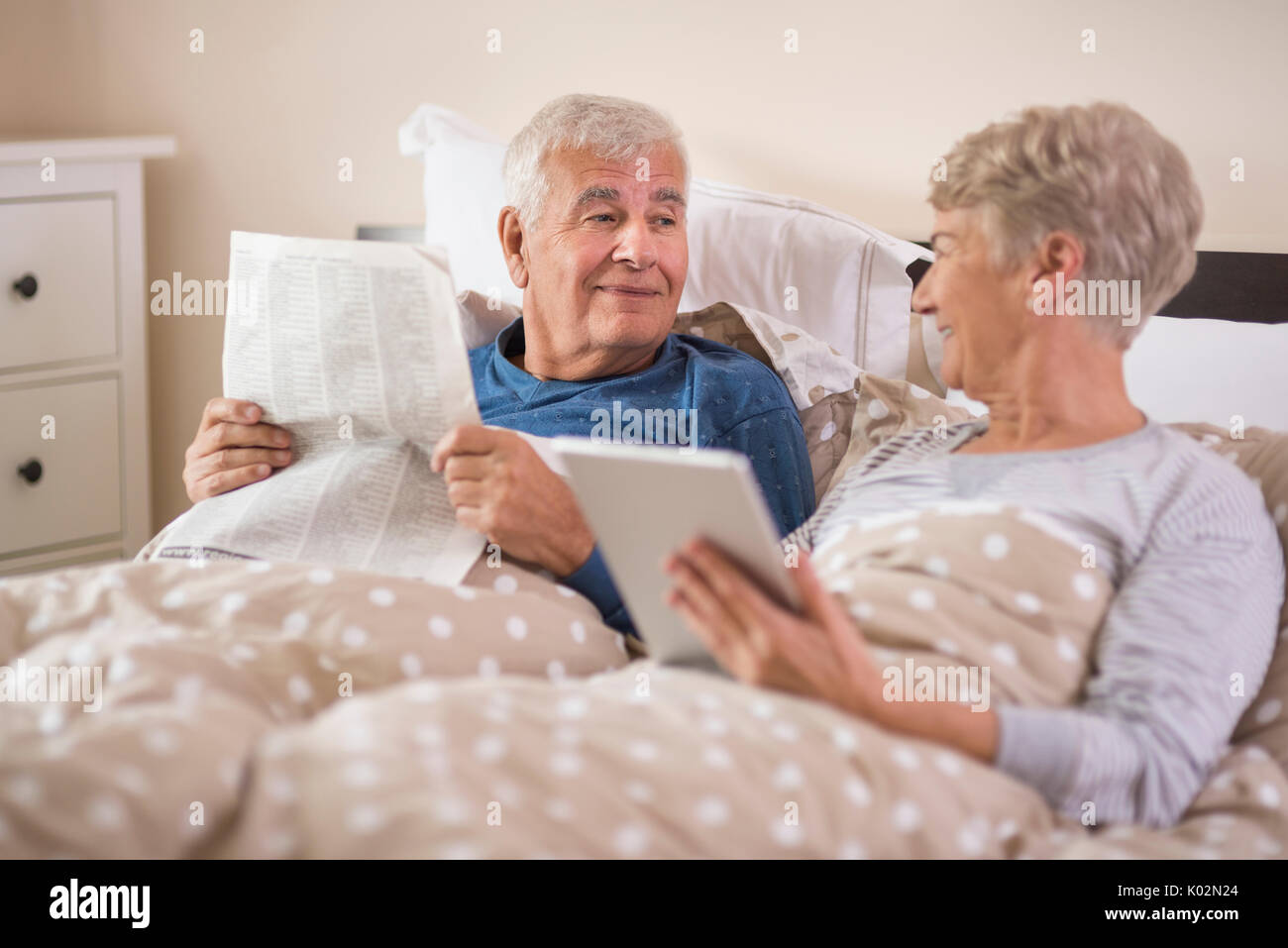 Both looking for some news on the Internet Stock Photo