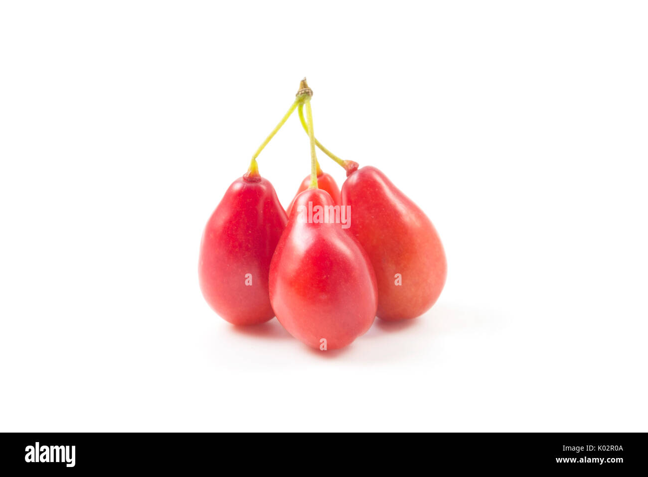 Cornelian cherry fruits on a white background Stock Photo