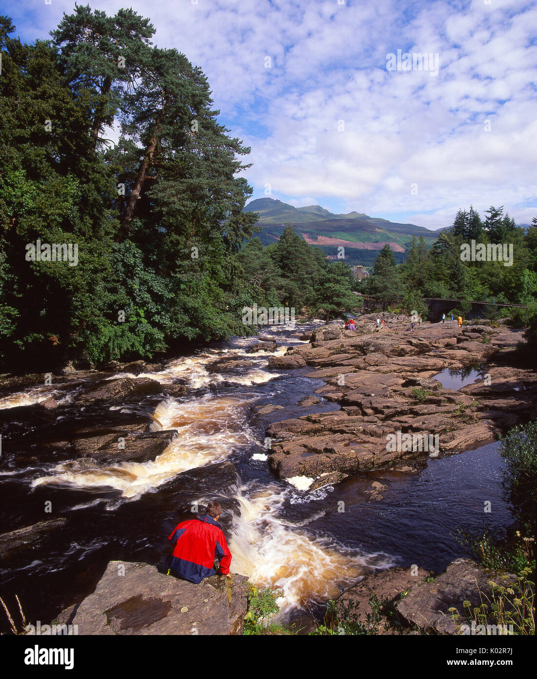 A beautiful summer view of the fast flowing Falls of Dochart situated ...