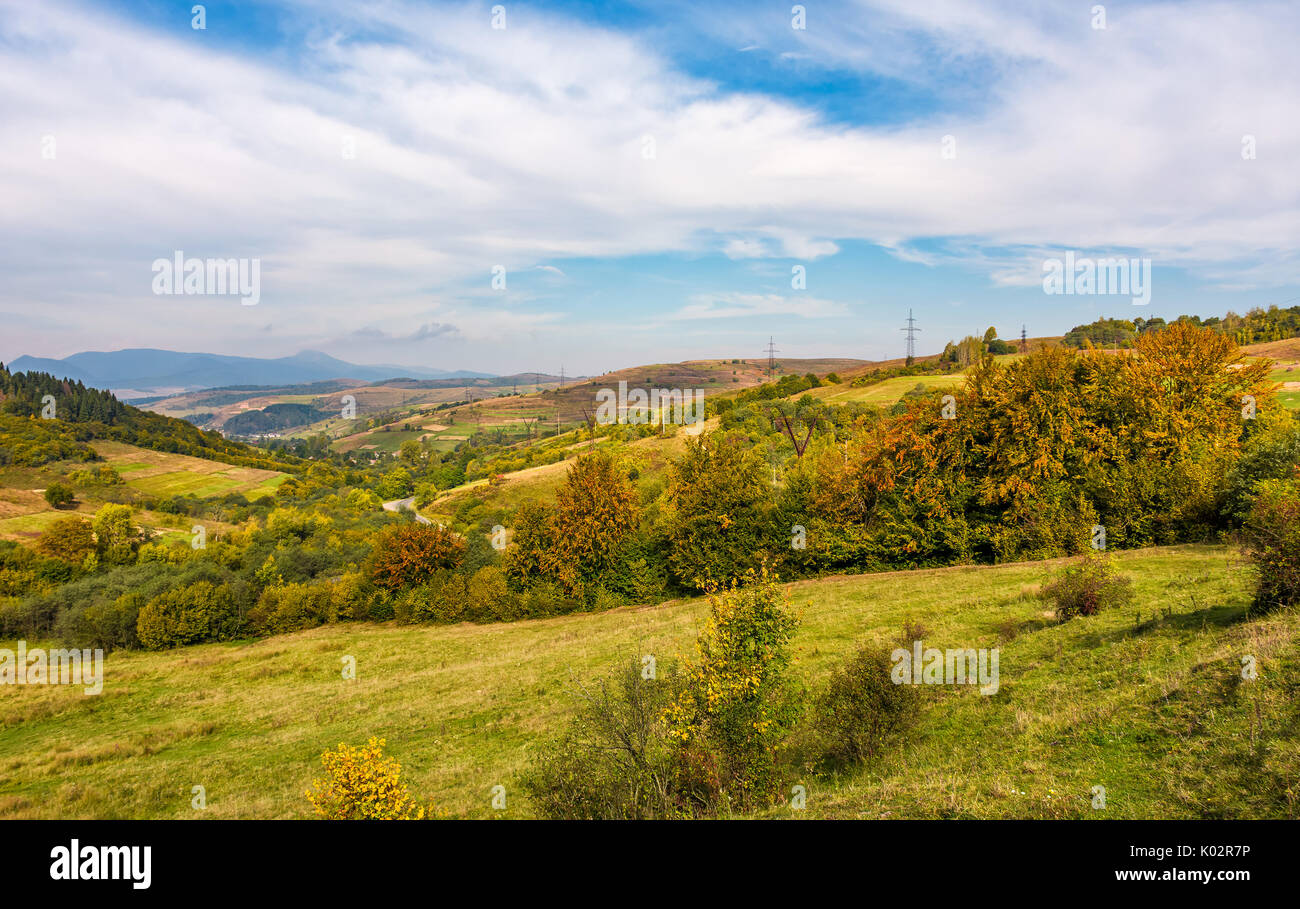 gorgeous countryside with village in valley. spectacular early autumn scenery in mountains Stock Photo