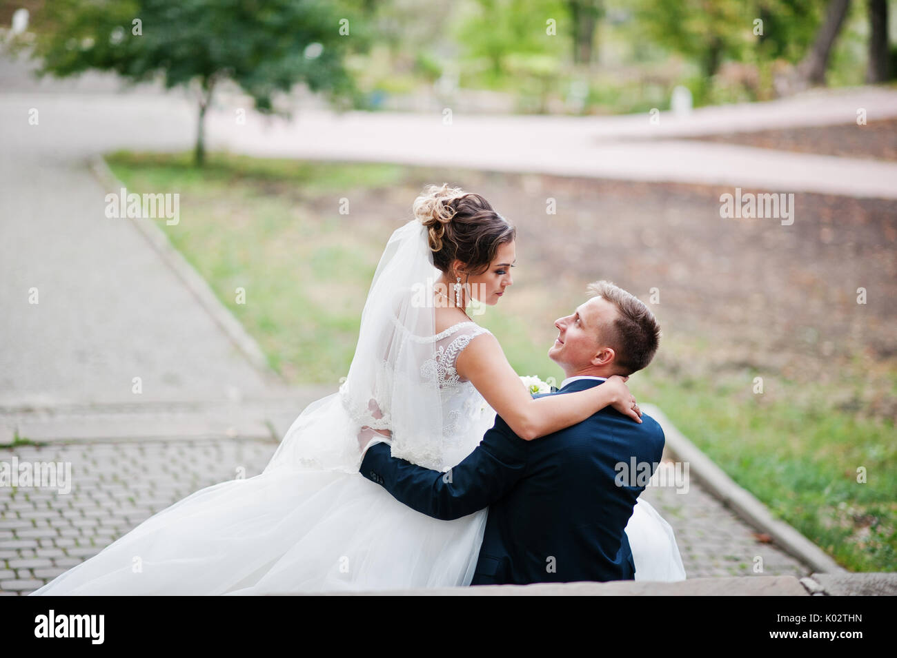 Wife sitting on husbands lap hi-res stock photography and images - Alamy