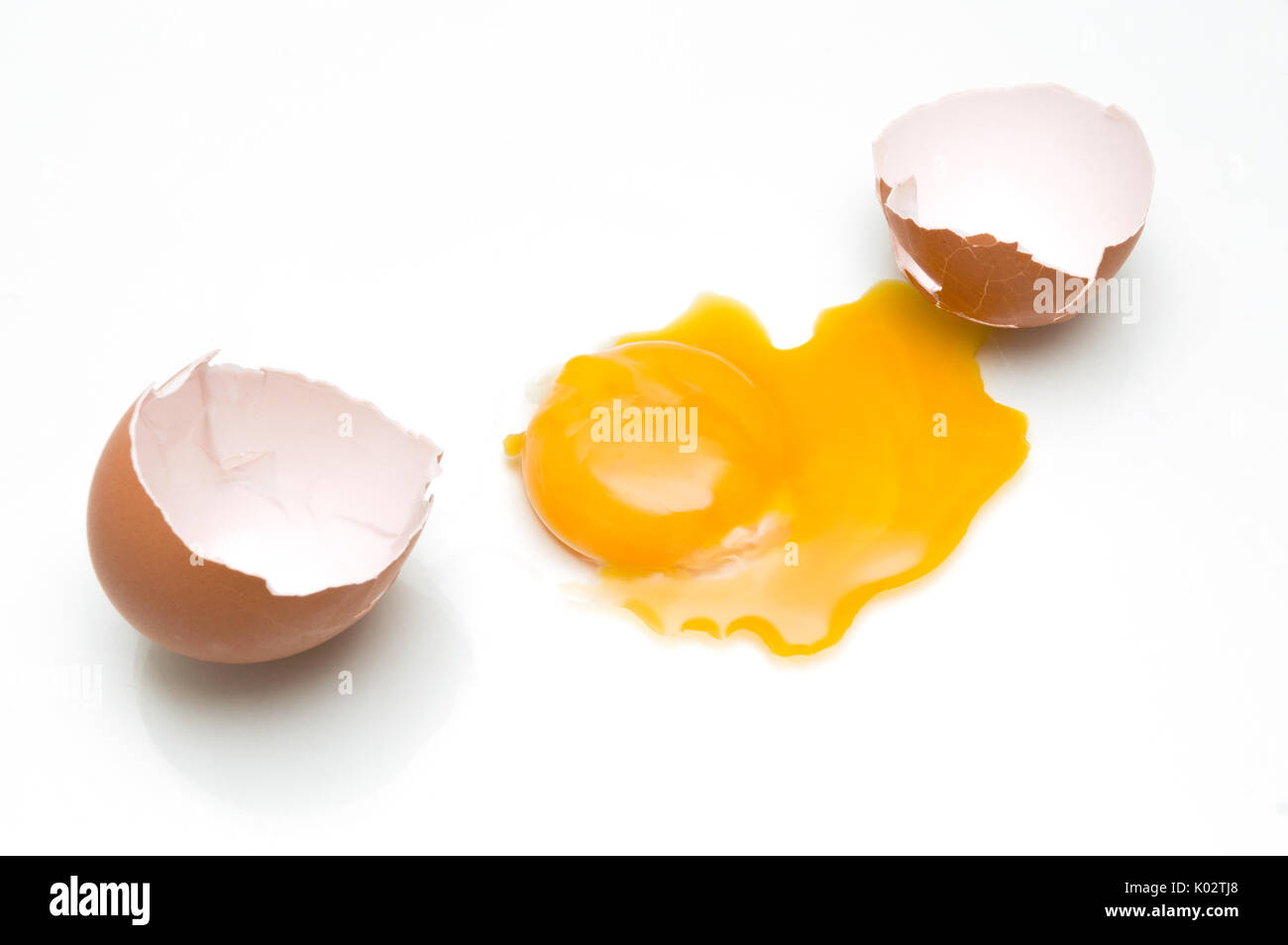 Broken egg isolated on white background Stock Photo