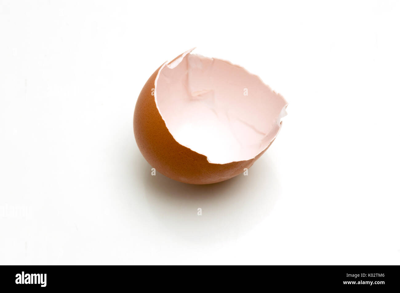 Broken egg isolated on white background Stock Photo