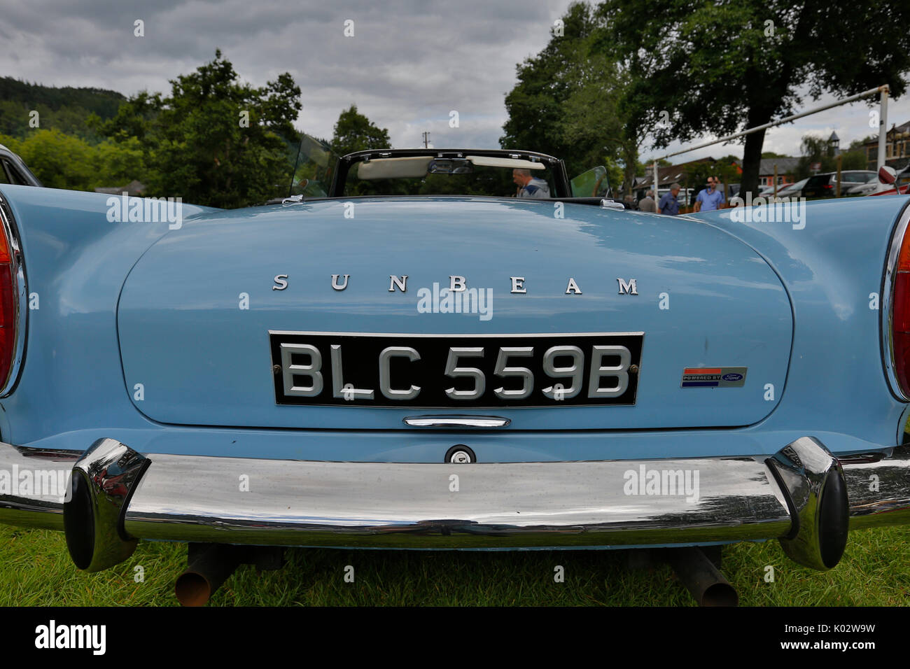 Blue classic Sunbeam parked outside. DVLA reg BLC 559B. all cars in uk belongs to dvlc. Classic blue car with nice chrome rear bumper at August 2017 Stock Photo