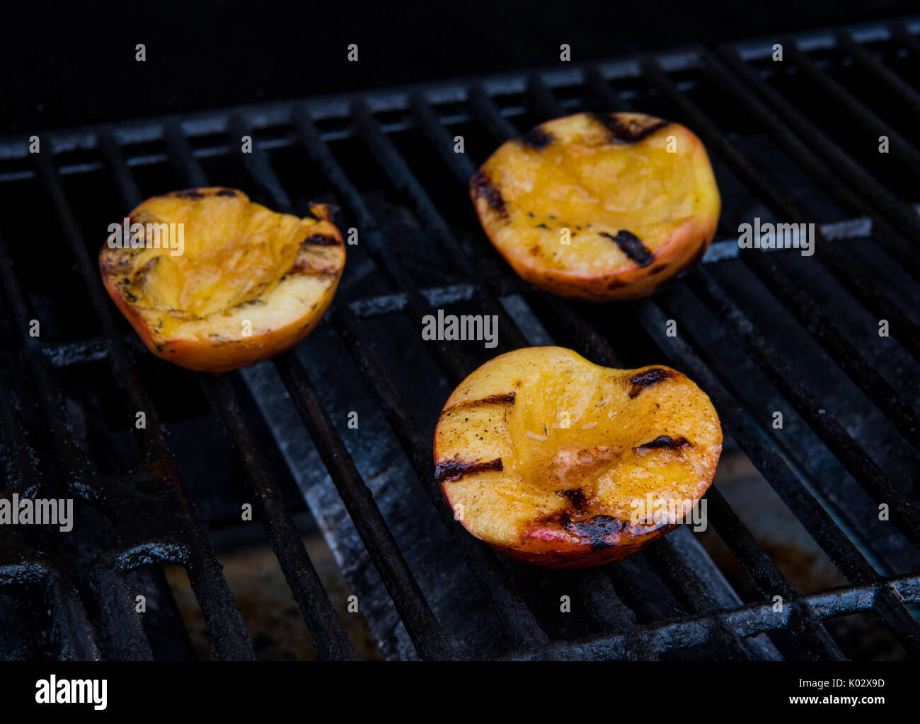 Peach Halves on Grill with char marks Stock Photo Alamy