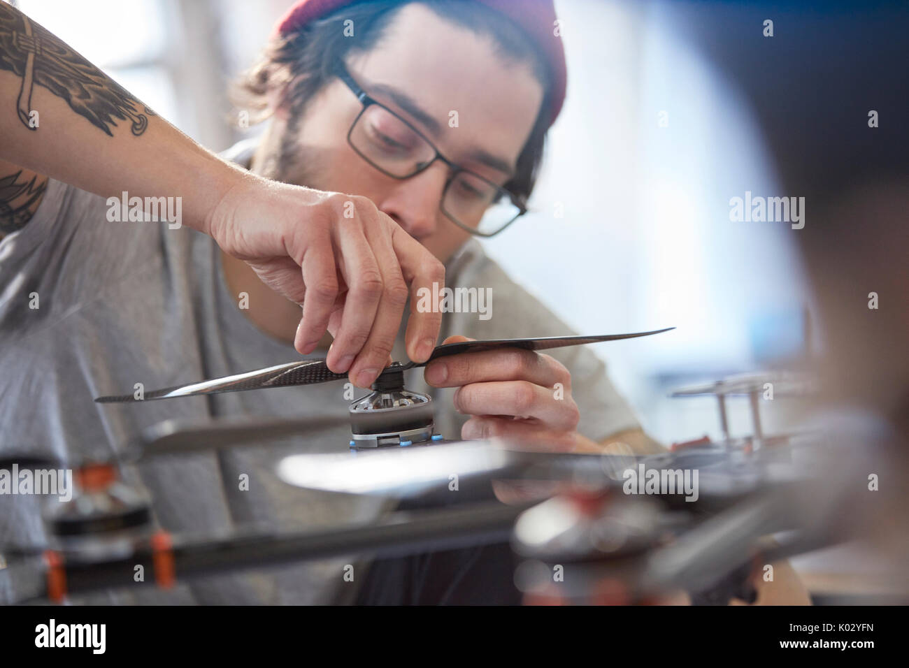 Male designer assembling drone Stock Photo