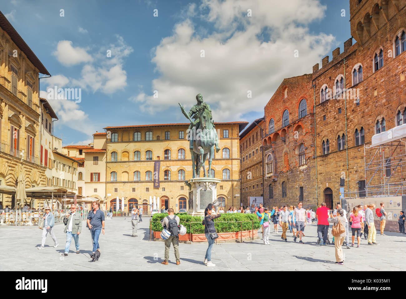 FLORENCE, ITALY- MAY 14, 2017: Square of Signoria (Piazza della Signoria) L-shaped square in front of the Palazzo Vecchio palace in Florence with tour Stock Photo