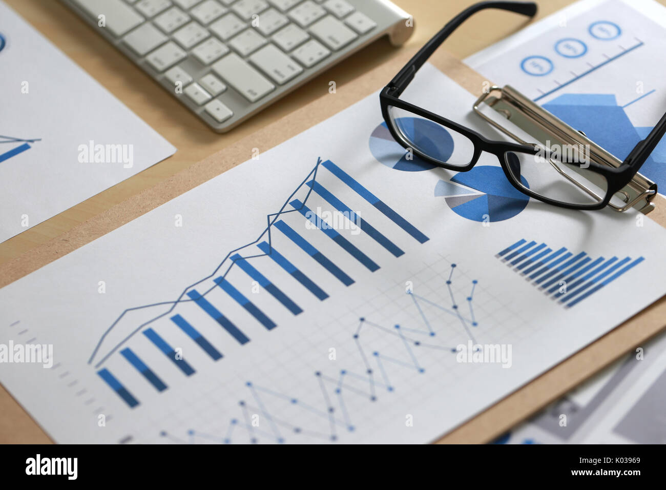 Business reports Teamwork on table report of documents Blue graphs and ...