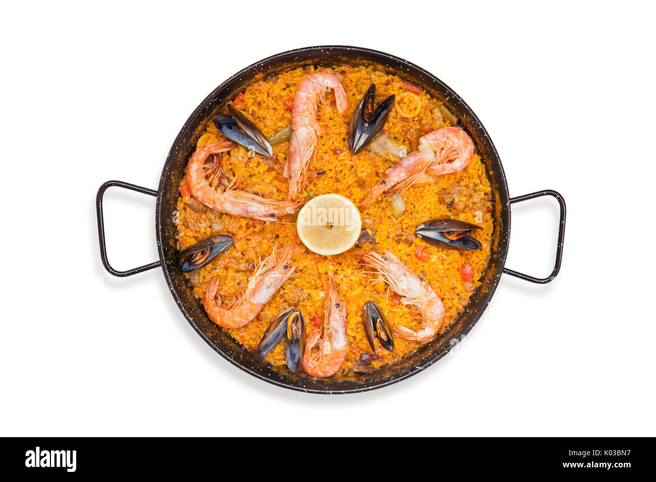 Top view of a typical spanish food, a paella Valenciana with rice, fish and vegetables Stock Photo