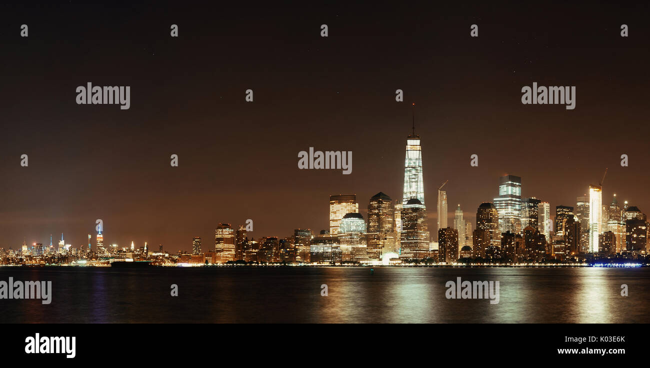 New York City downtown skyline at night panorama over Hudson River ...