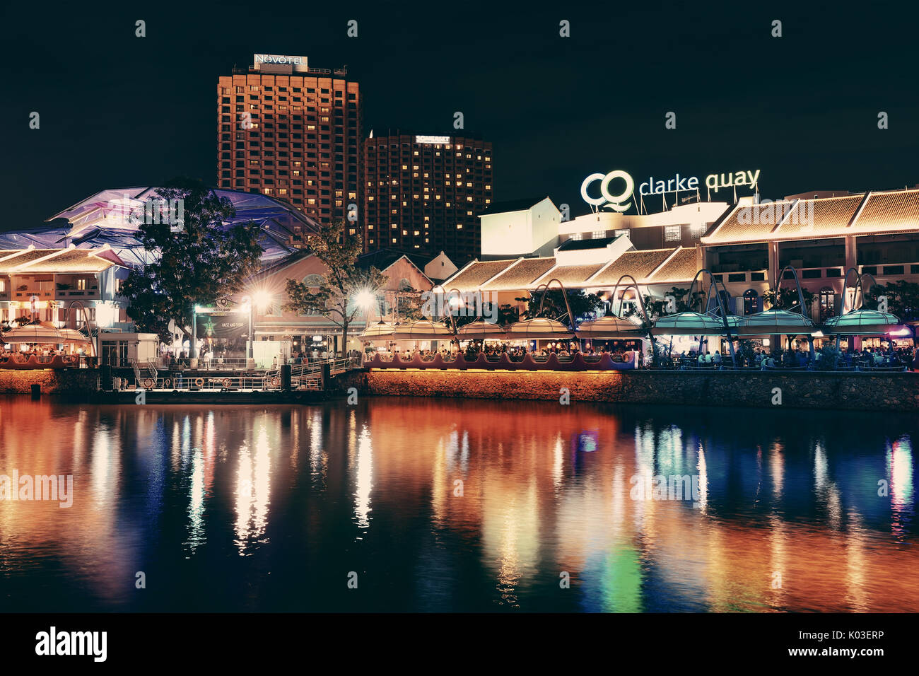 SINGAPORE - APR 5: Clarke Quay at night with street view and restaurant ...