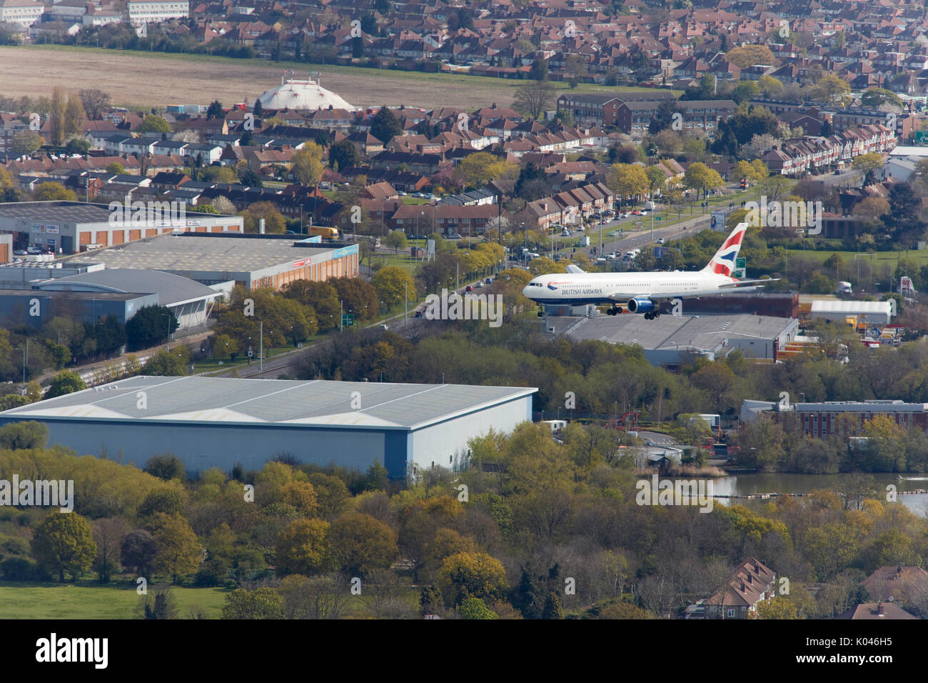 An aerial view of a passenger aircraft landing at Heathrow Airport, London Stock Photo