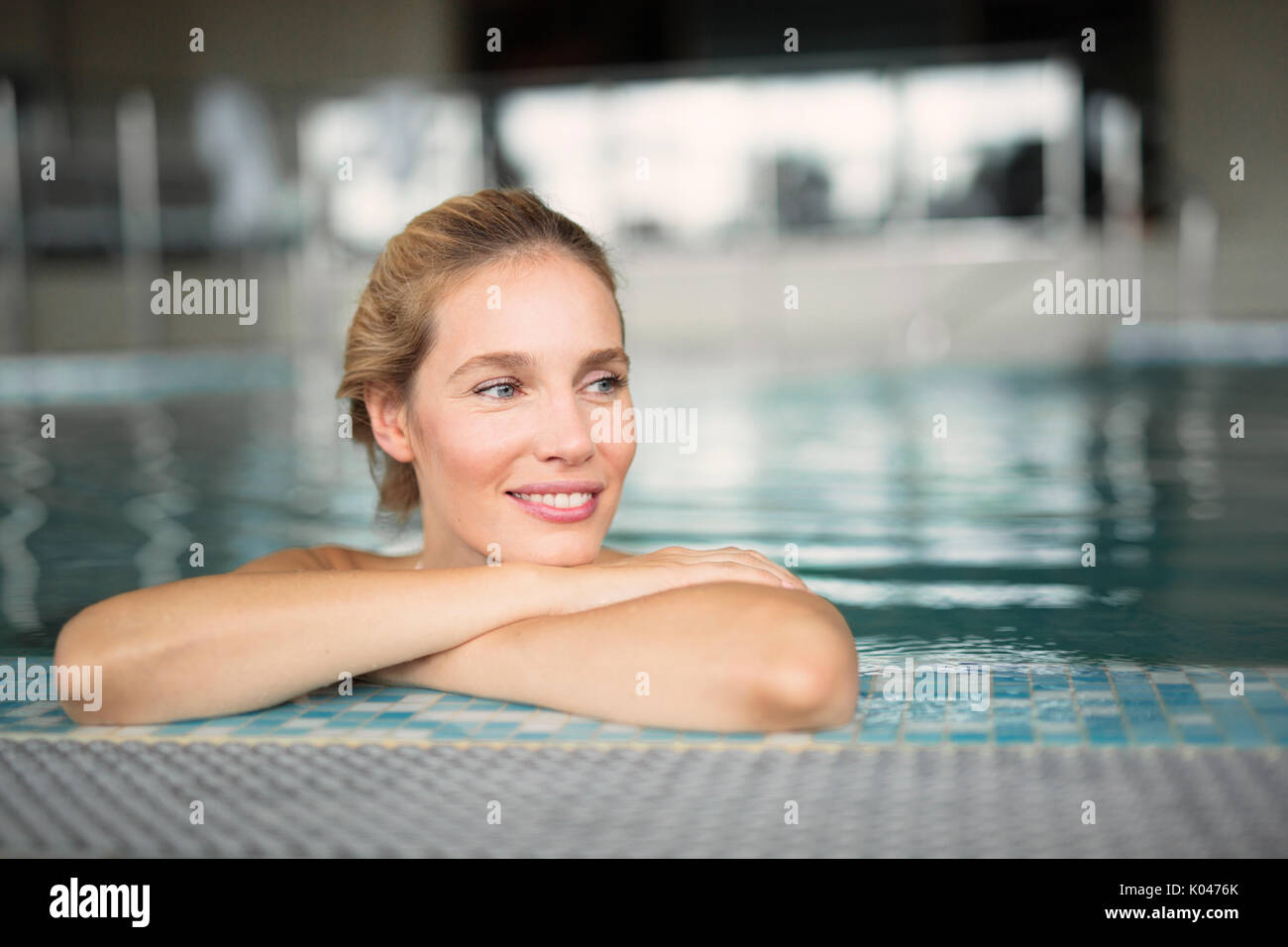 Portrait of beautiful woman relaxing in swimming pool Stock Photo - Alamy